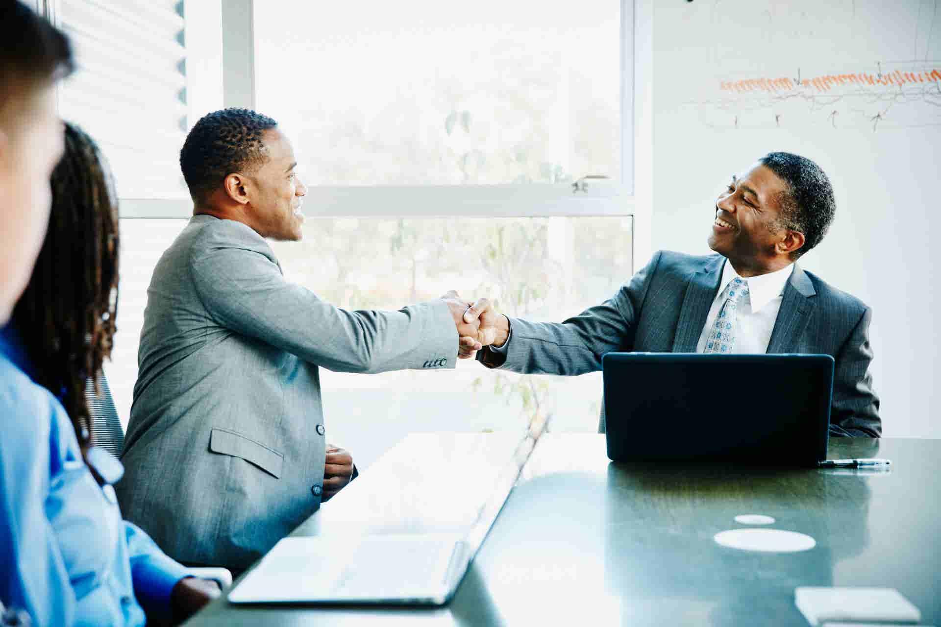 Two colleagues shaking hands